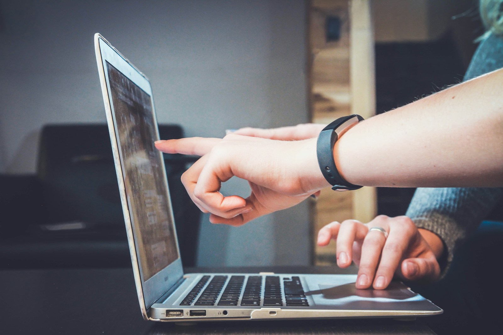 Client reviewing a website project on a laptop